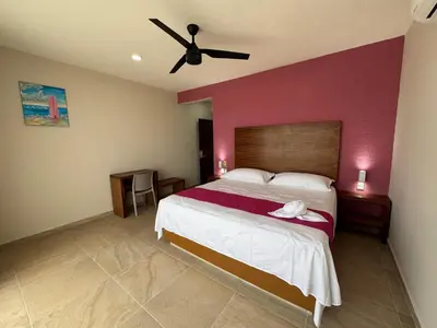 Cama o camas de una habitación en Aeropuerto Express Huatulco