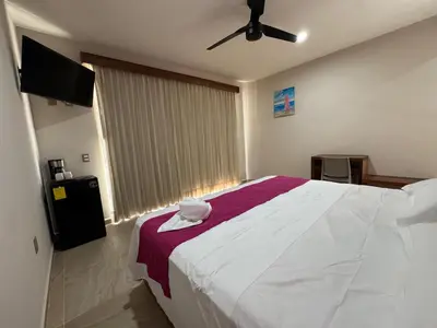 Cama o camas de una habitación en Aeropuerto Express Huatulco