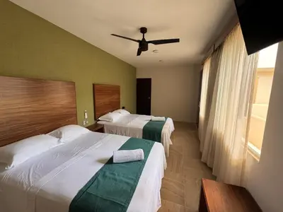 Cama o camas de una habitación en Aeropuerto Express Huatulco