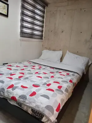 Cama o camas de una habitación en Living Universidad