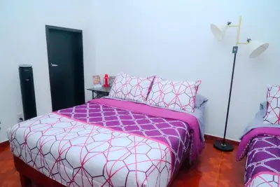 Cama o camas de una habitación en Habitación nueva y cálida con serenidad en la terraza GARCÍA LÓPEZ