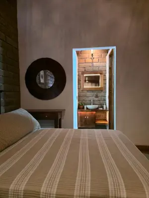Cama o camas de una habitación en Cabaña el rio la tranquilidad