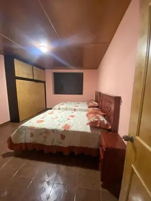Cama o camas de una habitación en Hospedaje Santa Rita