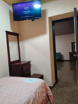 Cama o camas de una habitación en Hospedaje Santa Rita