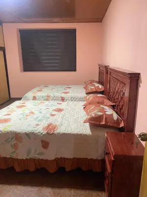 Cama o camas de una habitación en Hospedaje Santa Rita