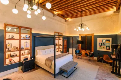 Cama o camas de una habitación en Por los Siglos de los Siglos Hotel