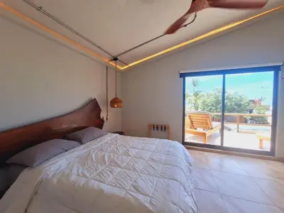Cama o camas de una habitación en Espectacular Suite Frente a Playa Zicatela 1BDR