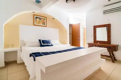Cama o camas de una habitación en Villa Palmitas acogedor departamento nivel piscina gigante jardines