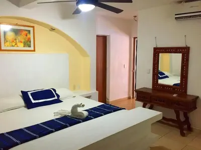 Cama o camas de una habitación en Villa Palmitas acogedor departamento nivel piscina gigante jardines
