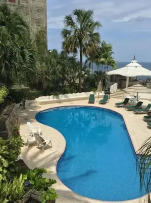 Piscina en o cerca de Villa Palmitas acogedor departamento nivel piscina gigante jardines