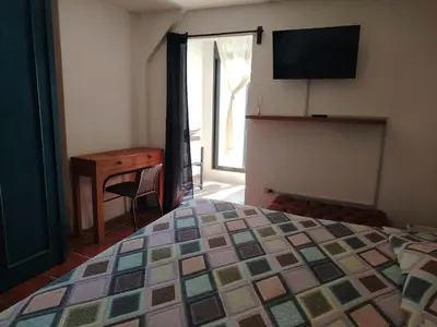 Cama o camas de una habitación en Cuatro Rumbos Hospedaje