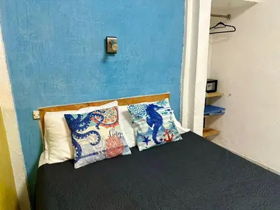 Cama o camas de una habitación en Brisa Marina Suites -A pasos del Acuario, Malecon y Playa
