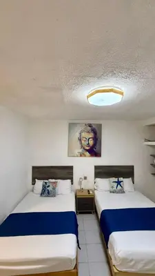 Cama o camas de una habitación en Brisa Marina Suites -A pasos del Acuario, Malecon y Playa
