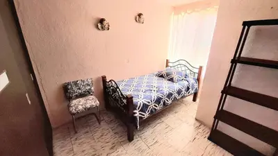 Cama o camas de una habitación en Casa de los abuelos Cholula