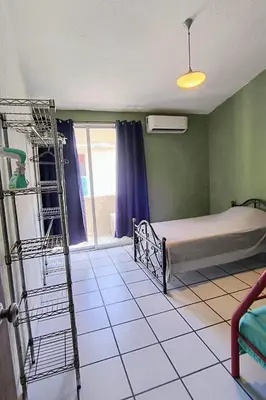 Cama o camas de una habitación en Vista a la bahia de Acapulco - Departamento para grupos de hasta 8 huéspedes