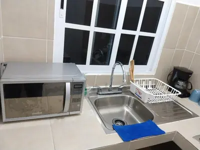 Una cocina o zona de cocina en Villa Cristina en Villas Camino Real cerca de las dunas de Chachalacas