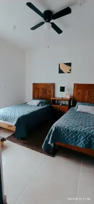 Cama o camas de una habitación en El paraíso del descanso