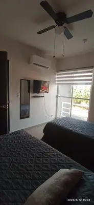 Cama o camas de una habitación en El paraíso del descanso