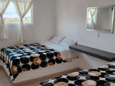 Cama o camas de una habitación en Hotel Los Ajolotes