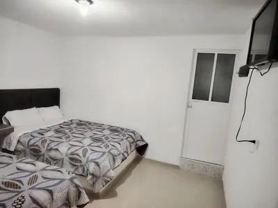 Cama o camas de una habitación en Hotel Los Ajolotes