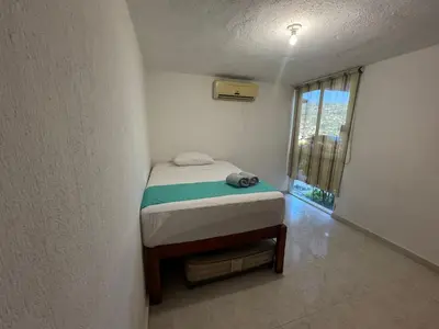 Cama o camas de una habitación en Comodo departamento cerca de Costera Acapulco