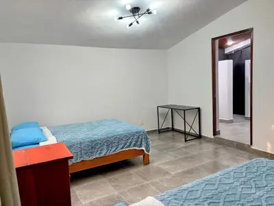 Cama o camas de una habitación en Espectacular casa con jardín y alberca privada