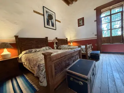 Cama o camas de una habitación en Hotel Monumento Hacienda de Amoltepec