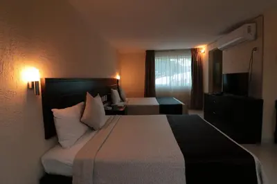 Cama o camas de una habitación en Quinta Chiapas
