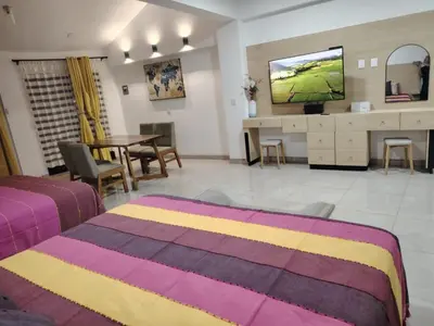 Una televisión o centro de entretenimiento en Apartament Furnished in Mitla