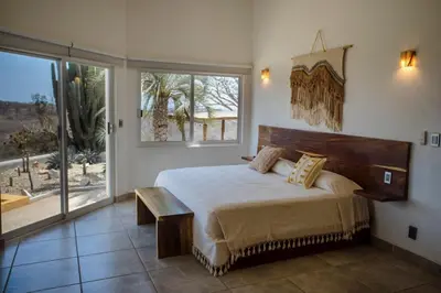 Cama o camas de una habitación en Casa Cumbres - Ocean View