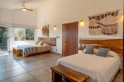 Cama o camas de una habitación en Casa Cumbres - Ocean View
