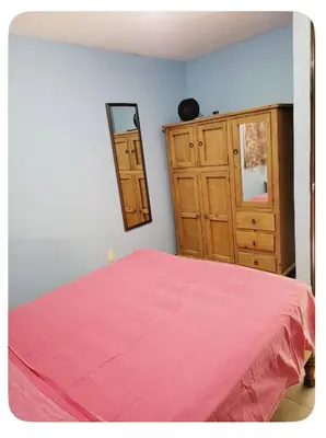 Cama o camas de una habitación en BANI departamento