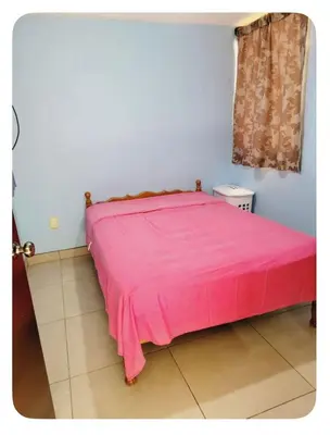 Cama o camas de una habitación en BANI departamento