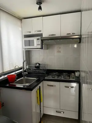 Una cocina o zona de cocina en Departamento comodo y centrico en Portales