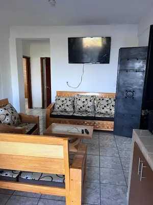 Una televisión o centro de entretenimiento en Depto nuevo 3 recamaras estacionamiento gratis