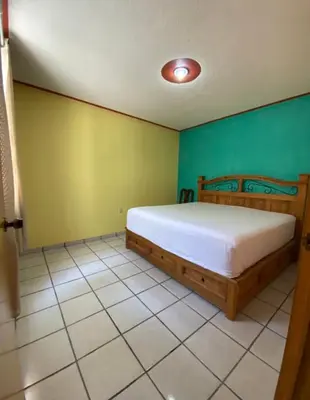 Cama o camas de una habitación en Casa Reforma Descanso y Bienestar en Oaxaca