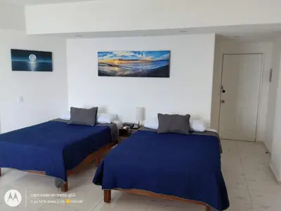 Cama o camas de una habitación en Suite Frontal a Pie de Playa con Terraza Panorámica