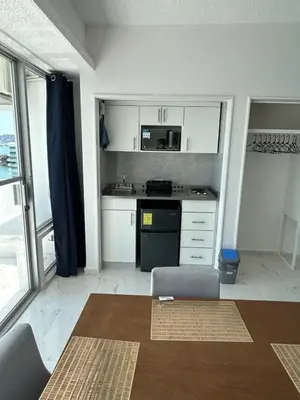 Una cocina o zona de cocina en Suite Frontal a Pie de Playa con Terraza Panorámica