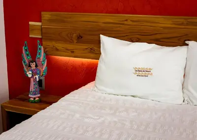 Cama o camas de una habitación en Las Raices de Oaxaca Hotel Boutique