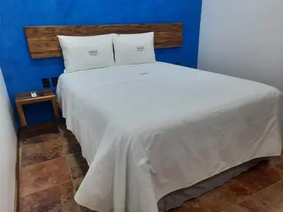 Cama o camas de una habitación en Las Raices de Oaxaca Hotel Boutique