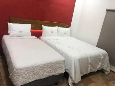 Cama o camas de una habitación en Las Raices de Oaxaca Hotel Boutique