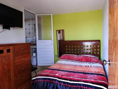 Cama o camas de una habitación en MJ Habitaciones Cholula