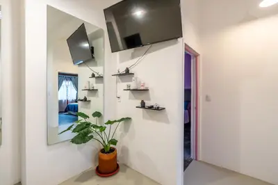Una televisión o centro de entretenimiento en Apartment in Convention Center, Oaxaca