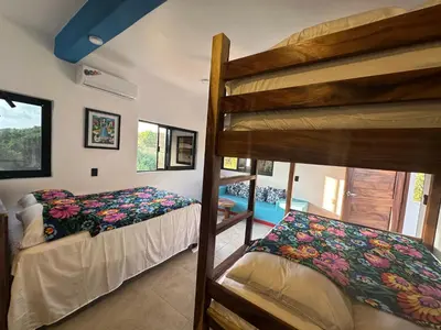 Cama o camas de una habitación en Beachfront Paradise Boutique Hotel - Sky Room