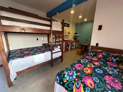 Cama o camas de una habitación en Beachfront Paradise Boutique Hotel - Sky Room