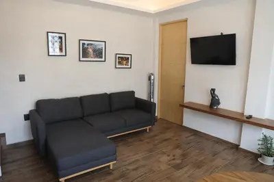 Una televisión o centro de entretenimiento en Casa Nogui