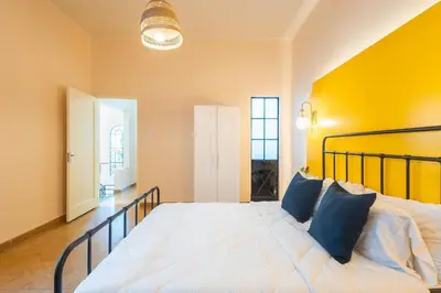 Cama o camas de una habitación en Casa céntrica con 4 habitaciones y estacionamiento