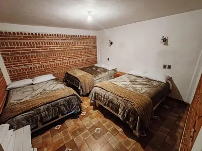 Cama o camas de una habitación en Cabañas Aruba