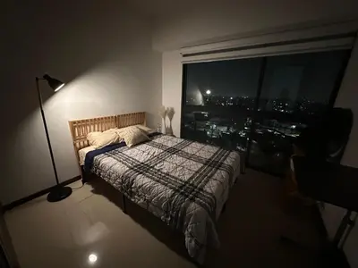 Cama o camas de una habitación en Habitación en departamento