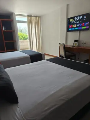 Cama o camas de una habitación en Hotel Central